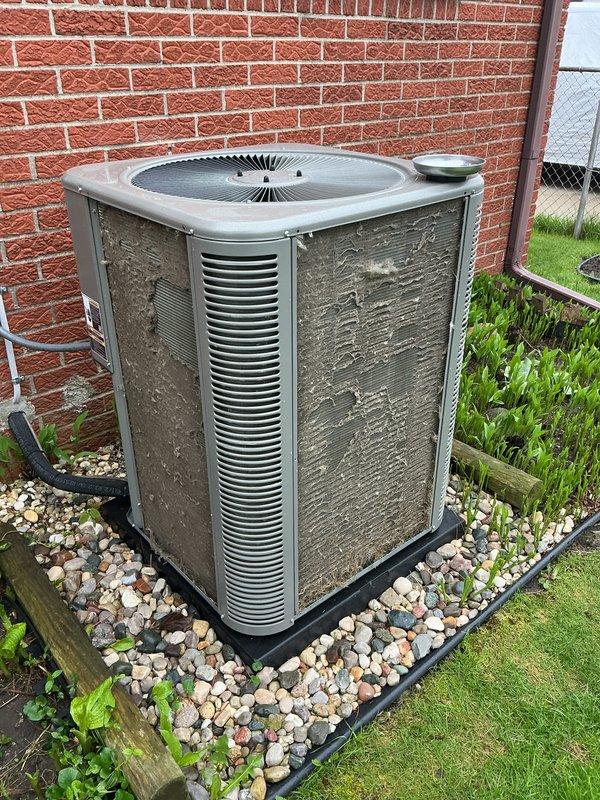 Completed annual preventive maintenance on residential air conditioning condenser unit. Performed comprehensive system inspection including visual assessment of cabinet condition, electrical connections, refrigerant lines, and condensate drainage. Unit showed signs of age with exterior weathering and dirt accumulation but was operating within normal parameters. Verified proper fan motor operation, checked electrical disconnect functionality, and confirmed adequate clearance around unit for airflow.