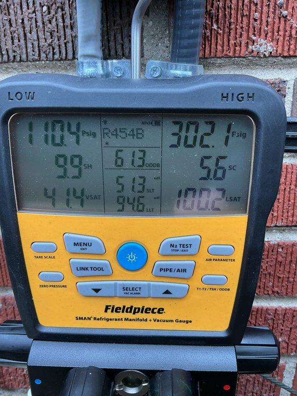 Replaced failed condenser fan motor on residential heat pump system. Connected refrigerant gauges to verify system pressures and temperatures during startup, confirming proper operation with low side reading 110.4 psig and high side reading 302.7 psig. Unit tested and operating within manufacturer specifications.