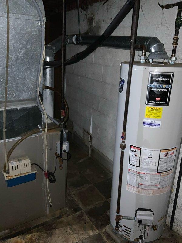 Completed on-site assessment for air conditioning system replacement in basement mechanical room. Current AC unit is non-operational while existing furnace remains functional and is of newer age. Evaluated existing HVAC infrastructure including ductwork, electrical connections, and available space for new equipment installation. Documented basement utility area configuration with water heater placement and existing furnace unit to determine optimal replacement approach. Prepared comprehensive estimate for AC-only replacement that will integrate with current heating system and existing duct distribution network.