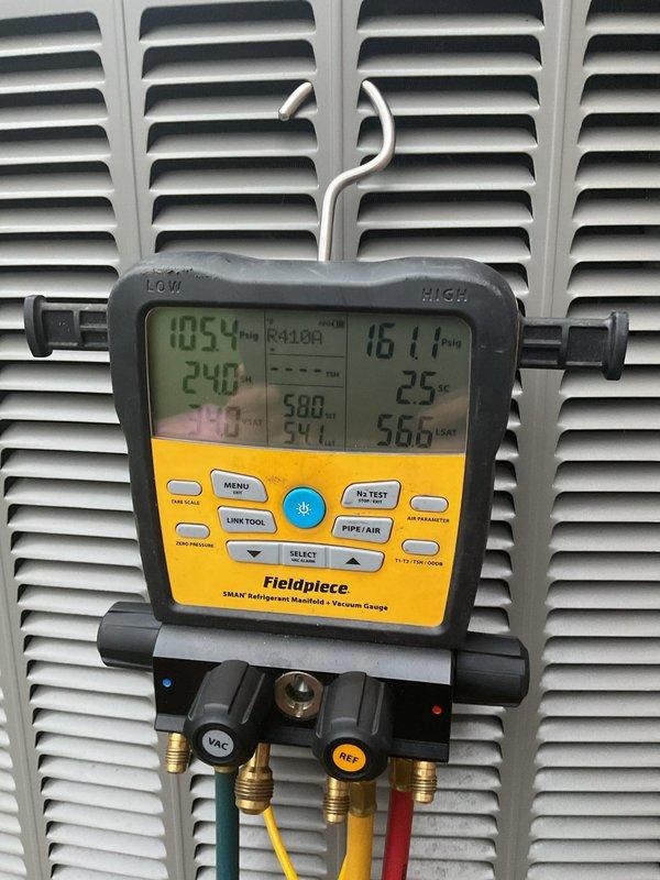 Performed scheduled air conditioning maintenance on residential split system. Checked refrigerant pressures and temperatures using digital manifold gauges, confirming R410A charge levels within manufacturer specifications. Replaced air filters and inspected outdoor condenser unit for proper operation and airflow clearance.