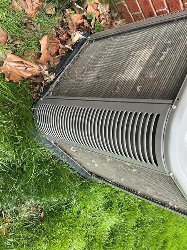 Completed annual cooling maintenance on outdoor condensing unit. Inspected heat exchanger coils, verified fin integrity, and documented mesh screen condition showing typical seasonal debris accumulation. Unit operational with no immediate service requirements identified.