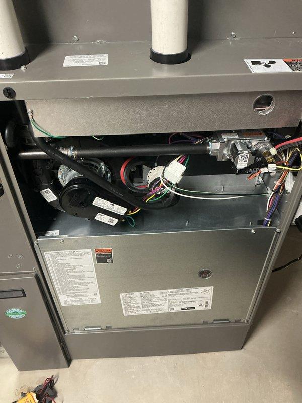 Completed annual HVAC maintenance on residential heating and cooling system. Serviced indoor air handler unit and outdoor condenser unit, addressing multiple inspection points including filter replacement and condenser pad assessment. Documented equipment condition with interior component photography showing blower assembly, control board, electrical connections, and venting system, as well as exterior condenser coil condition requiring attention due to accumulated debris on fins.