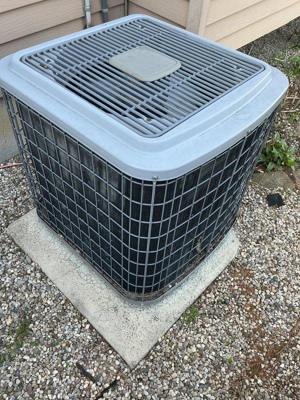 Completed annual furnace maintenance and tune-up on a brand new furnace system. Performed comprehensive inspection of outdoor condensing unit, which was found to be in excellent condition with proper installation on level concrete pad, adequate clearances maintained, and clean grille surfaces. Verified refrigerant lines properly secured to exterior wall, electrical conduit professionally installed, and surrounding drainage area clear of debris. Unit showed no signs of operational issues, with all components functioning within manufacturer specifications.