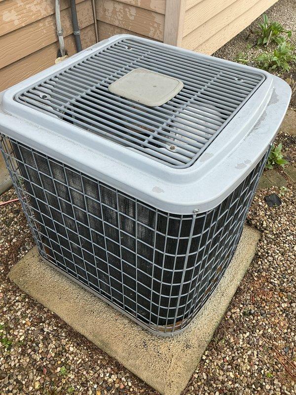 Completed annual furnace maintenance and tune-up on a brand new furnace system. Performed comprehensive inspection of outdoor condensing unit, which was found to be in excellent condition with proper installation on level concrete pad, adequate clearances maintained, and clean grille surfaces. Verified refrigerant lines properly secured to exterior wall, electrical conduit professionally installed, and surrounding drainage area clear of debris. Unit showed no signs of operational issues, with all components functioning within manufacturer specifications.