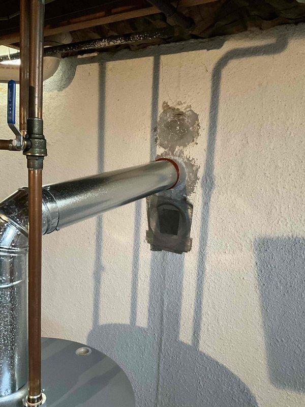 Provided estimate for complete HVAC system replacement including air conditioning condenser unit and furnace. Existing 24-year-old equipment is non-operational and has exceeded its serviceable lifespan. Documented current outdoor condenser unit positioned on decorative rock bed against exterior brick wall with electrical disconnect, and interior furnace installation in basement utility area with existing ductwork penetrations through insulated walls.