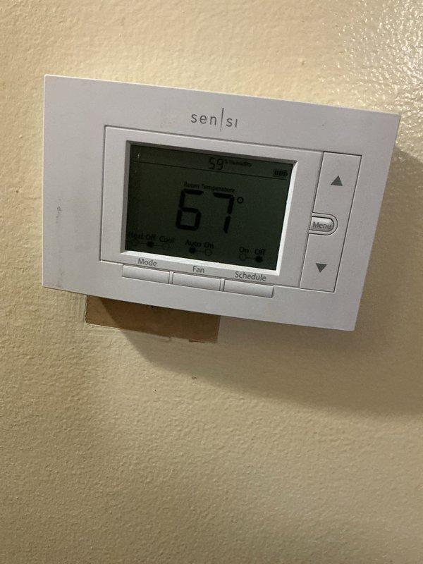 Completed scheduled ComfortGuard Maintenance visit including filter replacement and system inspection. Verified thermostat operation with proper temperature display and programming functionality, and performed electrical diagnostics confirming system voltage readings within manufacturer specifications at 369 volts.