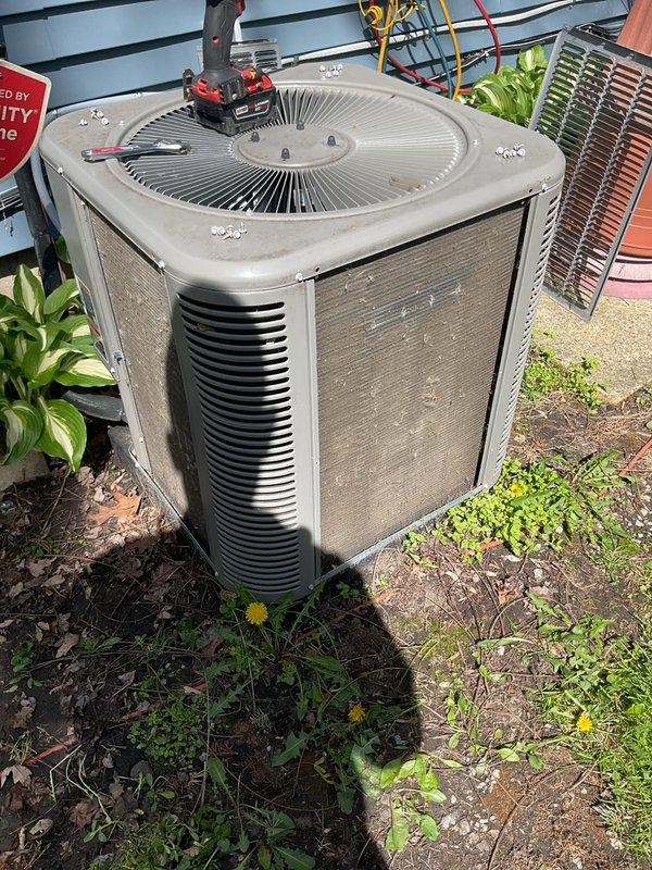 Completed comprehensive AC tune-up service on residential outdoor condenser unit. Performed standard maintenance procedures including system inspection, cleaning of condenser coils and exterior surfaces, capacitor testing with diagnostic gauges, and verification of proper electrical connections and refrigerant levels. Unit operational and running efficiently upon completion.