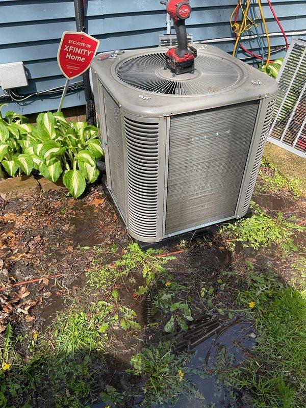 Completed comprehensive AC tune-up service on residential outdoor condenser unit. Performed standard maintenance procedures including system inspection, cleaning of condenser coils and exterior surfaces, capacitor testing with diagnostic gauges, and verification of proper electrical connections and refrigerant levels. Unit operational and running efficiently upon completion.