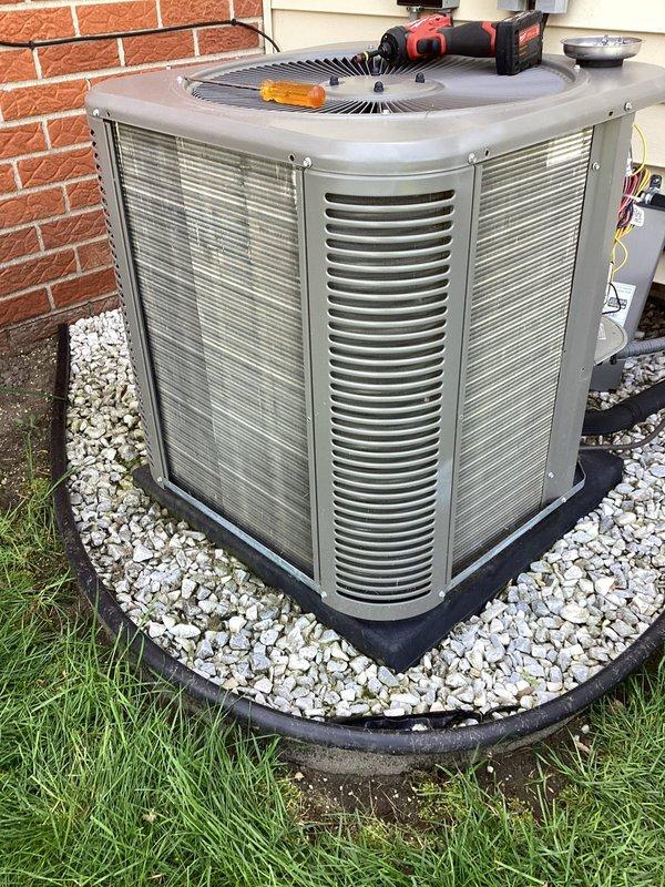 Completed annual Air Care Maintenance on residential outdoor condensing unit. Performed comprehensive system inspection, verified proper operation of compressor and condenser fan motor, checked refrigerant lines and electrical connections, and confirmed unit functionality. Equipment found in good operating condition with adequate airflow through coil louvers and proper drainage around gravel pad base.