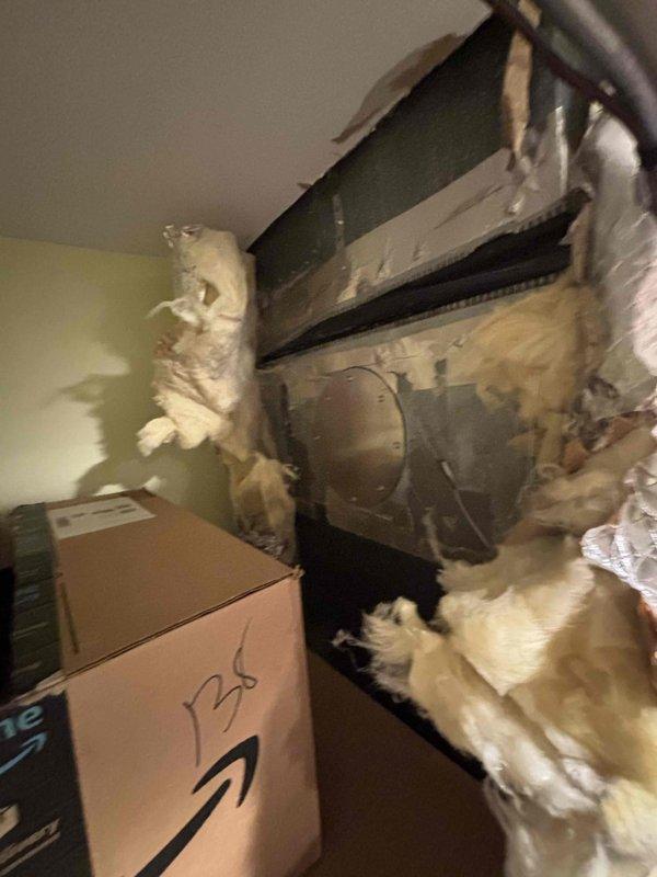 Completed on-site evaluation for AC replacement estimate on approximately 10-year-old system. Inspected existing wall-mounted air handler unit with refrigerant lines and assessed condition of surrounding insulation, noting deterioration and irregular coverage. Accessed ceiling cavity to examine air handler installation, ductwork connections, and insulation integrity. Documented equipment configuration, duct routing, and current system condition through comprehensive photography for replacement proposal preparation.
