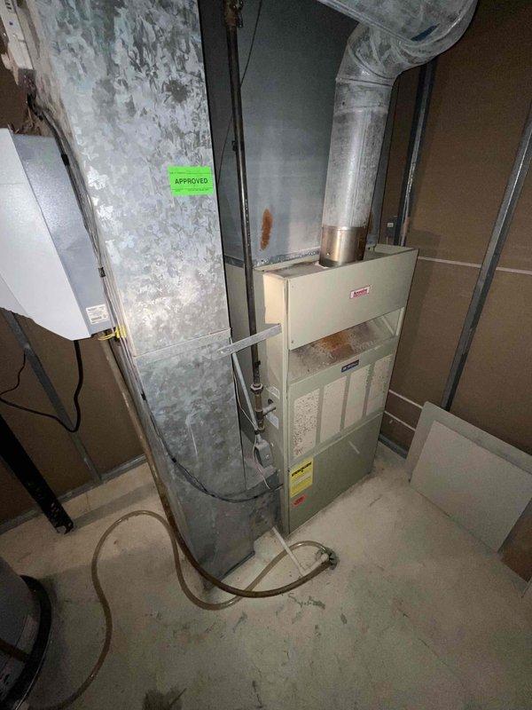 Provided comprehensive estimate for replacement of 38-year-old furnace and air conditioning system currently located in basement mechanical room. Existing natural gas furnace and AC unit are operational but have exceeded their expected service life. Assessed current installation configuration including ductwork connections, venting system, and utility space layout to determine optimal replacement equipment specifications and installation requirements for new high-efficiency HVAC system.