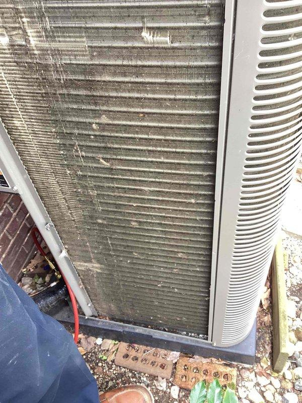 Performed comprehensive Air Care Maintenance on HVAC system including both heating and cooling components. Condenser unit exhibited heavy accumulation of dirt, dust, and debris on exterior coils and fins, which was thoroughly cleaned to restore optimal airflow and heat transfer efficiency. Cleared organic debris, leaves, and dirt from around unit base and surrounding area to prevent future blockage and ensure proper drainage. Inspected all accessible components, verified proper operation of condenser fan assembly, and confirmed system functionality upon completion of maintenance service.