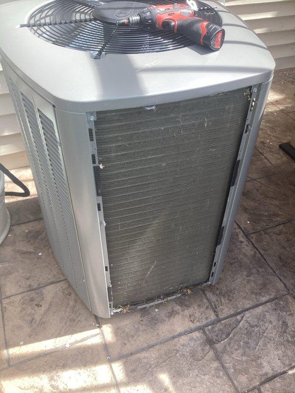 Completed comprehensive 5-year ComfortGuard maintenance service on outdoor condensing unit. Performed thorough inspection of all system components including condenser coils, fan assembly, and electrical connections. Condenser coils showed moderate accumulation of dirt and debris between fins, which was addressed during service. Cleaned and serviced unit exterior panels showing weather-related wear and discoloration. Verified proper operation of condenser fan and motor assembly protected by fan guard. All mechanical fasteners checked and secured as needed. Unit restored to optimal operating condition and ready for continued service.