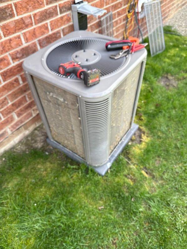 Completed comprehensive air conditioning maintenance inspection on outdoor condenser unit. Performed diagnostic testing using multimeter to verify electrical components, checked voltage and amperage readings, and inspected disconnect box functionality. System operating within normal parameters with no deficiencies observed.