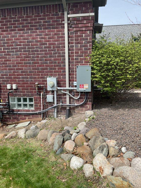 Successfully installed a 20kW 200-amp automatic transfer switch generator system, including all necessary electrical connections, transfer switch integration, gas piping, and pressure testing. All required permits were obtained for mechanical, electrical, generator, gas pipe, pressure test, and transfer switch components. The installation included mounting exterior electrical components with proper conduit routing along the building's brick exterior, and installing the automatic transfer switch panel in the interior utility space with appropriate safety labeling and inspection approvals.