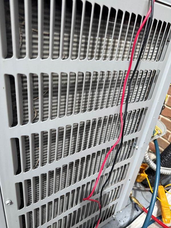 Completed annual cooling maintenance on Goodman outdoor condensing unit. Performed comprehensive system inspection, tested electrical components with multimeter, and verified proper operation of compressor and condenser fan. Unit operating within normal parameters with no issues identified.