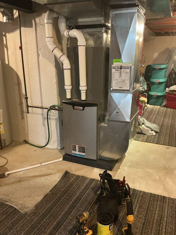 Completed annual HVAC maintenance on residential furnace and air handler system in basement mechanical room. Performed comprehensive inspection of furnace unit, verified proper operation of all components, checked PVC venting system for secure connections and proper drainage, and inspected electrical connections. Examined air handler and ductwork for proper airflow and structural integrity. System found to be operating within manufacturer specifications with no immediate service needs identified.