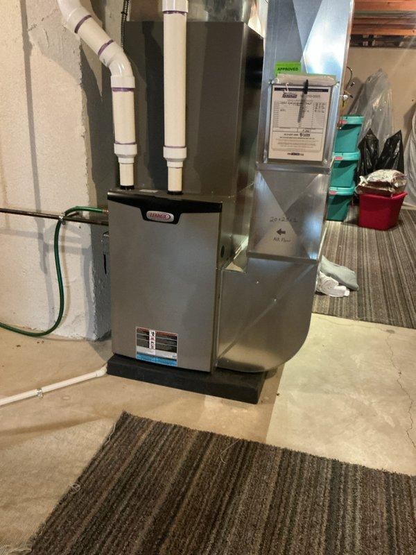 Completed annual HVAC maintenance on residential furnace and air handler system in basement mechanical room. Performed comprehensive inspection of furnace unit, verified proper operation of all components, checked PVC venting system for secure connections and proper drainage, and inspected electrical connections. Examined air handler and ductwork for proper airflow and structural integrity. System found to be operating within manufacturer specifications with no immediate service needs identified.