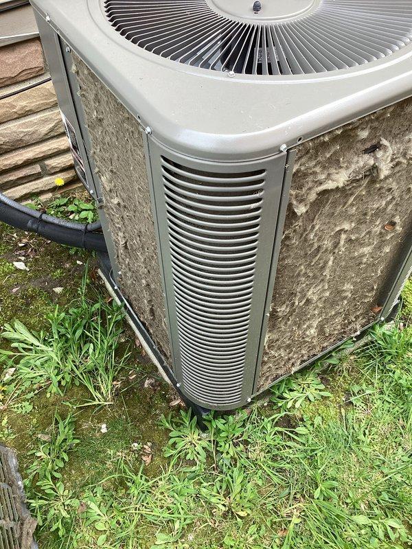 Completed annual preventive maintenance on residential air conditioning system. Unit exterior showed significant dirt and debris accumulation on condenser panels and coils. Performed thorough inspection of outdoor condenser unit, checked refrigerant levels, tested electrical connections, and verified proper operation of all components. System operating within normal parameters upon completion of service.