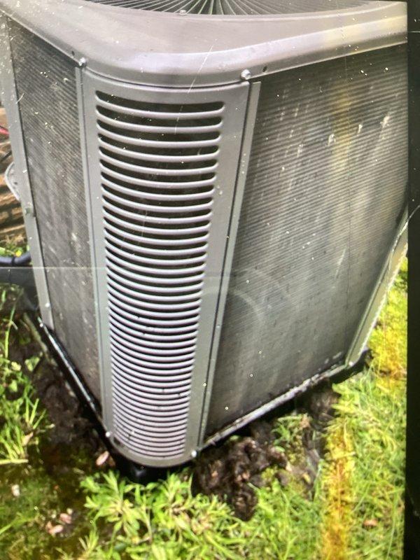 Completed annual preventive maintenance on residential air conditioning system. Unit exterior showed significant dirt and debris accumulation on condenser panels and coils. Performed thorough inspection of outdoor condenser unit, checked refrigerant levels, tested electrical connections, and verified proper operation of all components. System operating within normal parameters upon completion of service.