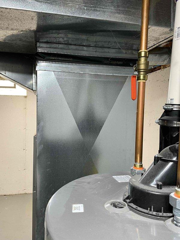 Conducted comprehensive evaluation of 18-year-old Armstrong furnace and air conditioning system in residential basement mechanical room. Assessed existing air handler, ductwork connections, plenum configuration, and overall system condition to provide detailed estimate for complete HVAC system replacement. Documented equipment layout, electrical connections, and existing infrastructure through photographs to support replacement recommendations for new furnace and air conditioner installation.