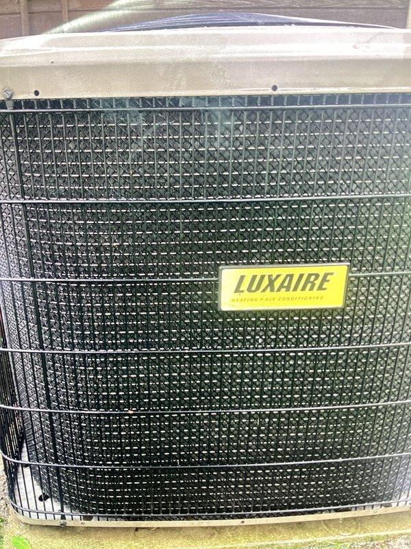 Completed annual maintenance on Luxaire outdoor condensing unit. Performed comprehensive system diagnostics using digital manifold gauges, recording refrigerant pressures and temperatures including superheat at 294°F and subcooling at 45°F. All operating parameters measured and found within acceptable ranges for proper system operation.
