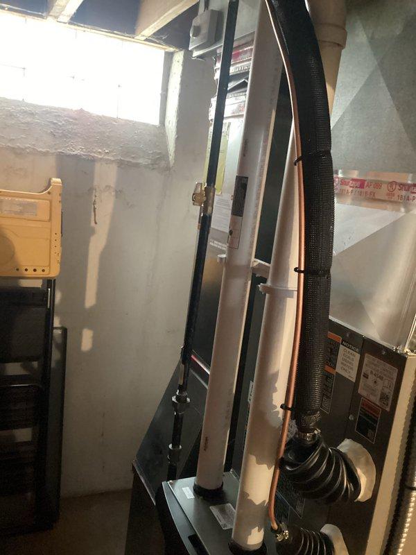 Completed full HVAC system installation including 70,000 BTU furnace with humidifier and liner, and 2-ton air conditioning unit with rear discharge configuration. Installed new equipment in basement utility area with copper refrigerant lines, proper insulation, and electrical connections. All mechanical and electrical permits were obtained prior to installation, system reconnected and operational upon completion.