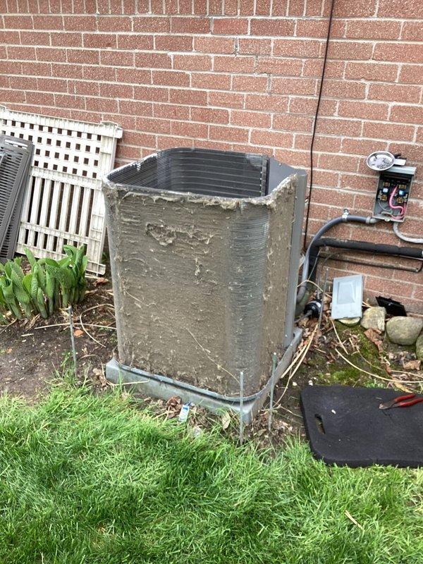 Completed annual cooling maintenance on residential split system. Performed comprehensive inspection of outdoor condensing unit, which showed significant dirt and debris accumulation on exterior surfaces. Cleaned condenser coil, checked electrical connections at disconnect box, verified proper operation of all components, and ensured adequate clearance around unit. System operating within normal parameters upon completion of maintenance service.