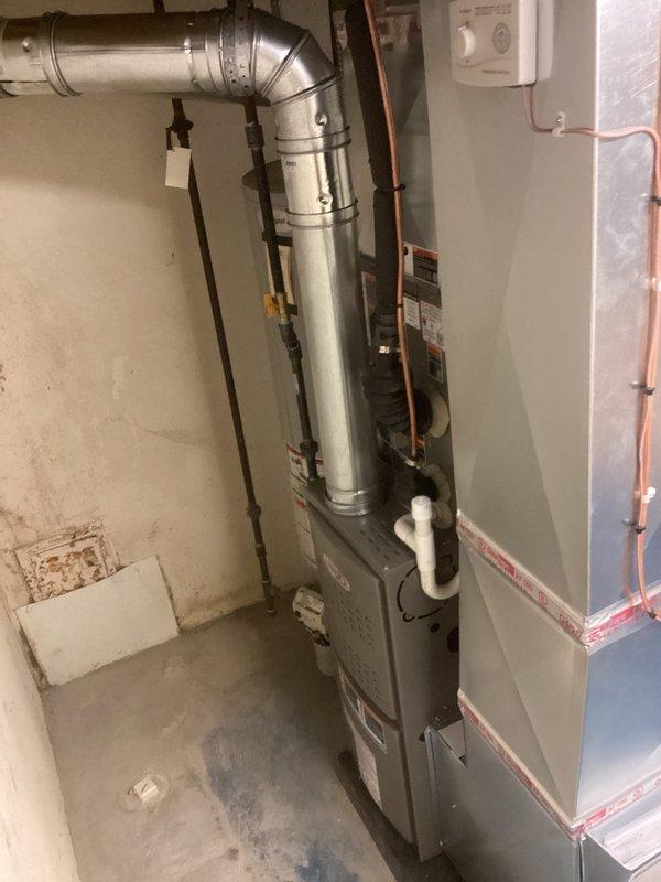 Completed full HVAC system installation including a 70,000 BTU gas furnace with humidifier and 2-ton air conditioning unit with rear discharge configuration. Installed all necessary ductwork, refrigerant lines, condensate drainage, and electrical connections in basement mechanical room. System tested and operational with all permits obtained for mechanical and electrical work.