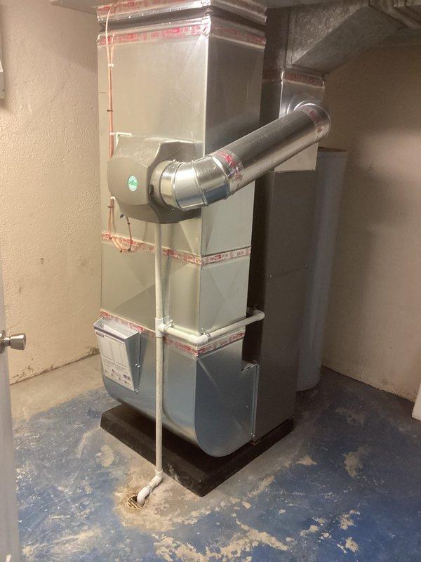 Completed full HVAC system installation including a 70,000 BTU gas furnace with humidifier and 2-ton air conditioning unit with rear discharge configuration. Installed all necessary ductwork, refrigerant lines, condensate drainage, and electrical connections in basement mechanical room. System tested and operational with all permits obtained for mechanical and electrical work.