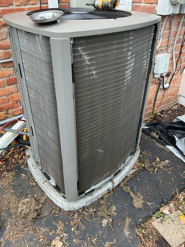 # HVAC Maintenance - ACM Completed

Performed routine Air Care Maintenance on residential air conditioning condenser unit. Unit exterior panels were heavily soiled with accumulated dirt, debris, and environmental contaminants. Thoroughly cleaned condenser coils, removed leaves and organic matter from base and surrounding area, and cleaned exterior cabinet panels. Inspected electrical connections at disconnect box, verified proper airflow through condenser grilles, and ensured unit was operating within normal parameters. All maintenance tasks completed per standard ACM protocol.