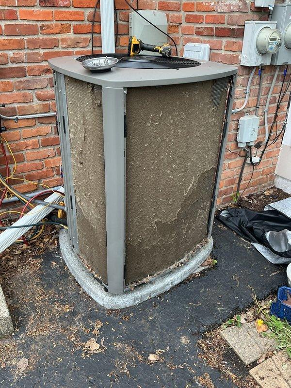 # HVAC Maintenance - ACM Completed

Performed routine Air Care Maintenance on residential air conditioning condenser unit. Unit exterior panels were heavily soiled with accumulated dirt, debris, and environmental contaminants. Thoroughly cleaned condenser coils, removed leaves and organic matter from base and surrounding area, and cleaned exterior cabinet panels. Inspected electrical connections at disconnect box, verified proper airflow through condenser grilles, and ensured unit was operating within normal parameters. All maintenance tasks completed per standard ACM protocol.