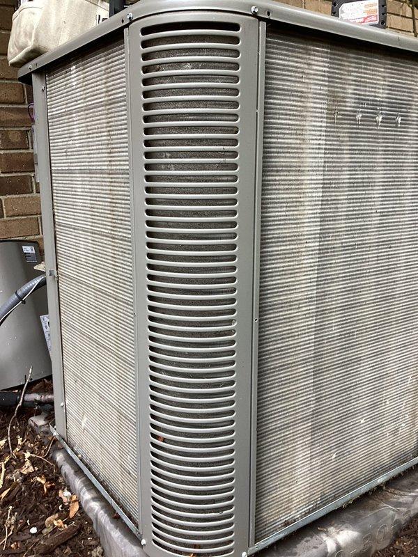 Performed routine annual maintenance on outdoor air conditioning condenser unit. Replaced air filter and evaporator pad as needed. Unit showed normal weathering and surface discoloration but is operating within specifications. Surrounding area cleared of debris and leaves to ensure proper airflow around equipment.