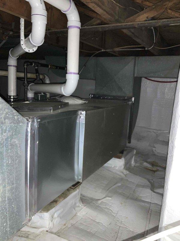 Provided estimate for new air conditioning system installation at residential property. Assessed crawl space location containing existing air handler unit with associated ductwork and PVC condensate drainage system. Evaluated structural conditions, vapor barrier installation, and available space for potential AC condenser placement outside the home to complete the cooling system configuration.