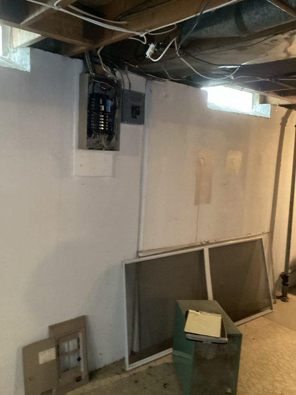 Conducted on-site assessment of existing 60-amp electrical service in 1960s single-family residence to provide estimate for panel upgrade to 150-amp service. Inspected current electrical panel installation located in basement area, documenting existing breaker configuration, wire sizing, panel condition, and service entrance equipment. Evaluated existing subpanel and disconnect box, noting current wiring methods and circuit distribution. Assessed structural considerations including available space for new panel installation, service entrance location, and necessary modifications to accommodate upgraded electrical service. Photographed existing electrical infrastructure to document current conditions for estimate preparation.