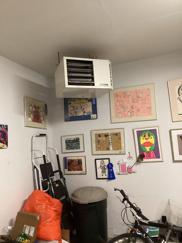 Performed comprehensive maintenance on an 18+ year old Reznor hanging garage heater unit. Completed full system inspection including operational checks, safety controls verification, and component assessment. Unit found to be functioning properly with no immediate repairs required at time of service.