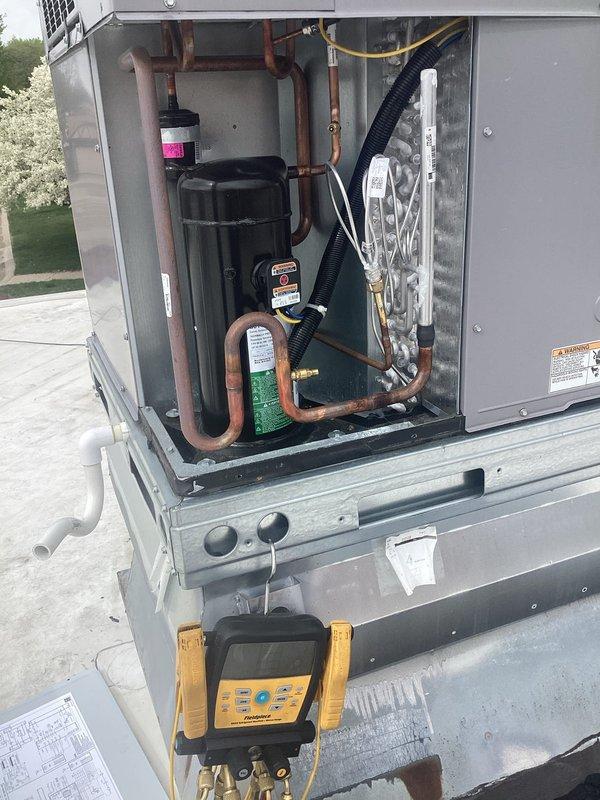 Completed scheduled RTU maintenance including full system inspection, filter check, and performance verification. Unit was accessed, refrigerant pressures were measured using digital manifold gauges, and all electrical components were inspected to ensure proper operation. System is operating within normal parameters with no issues identified.