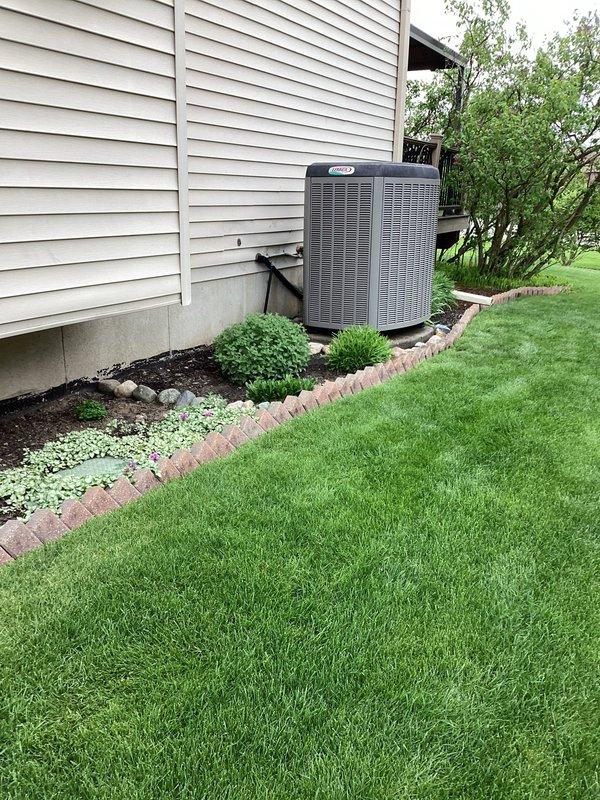 Completed annual cooling maintenance on residential split system. Identified filter requiring replacement during inspection. Documented equipment condition with exterior photos showing dual condensing units positioned on concrete pad with proper clearances maintained.