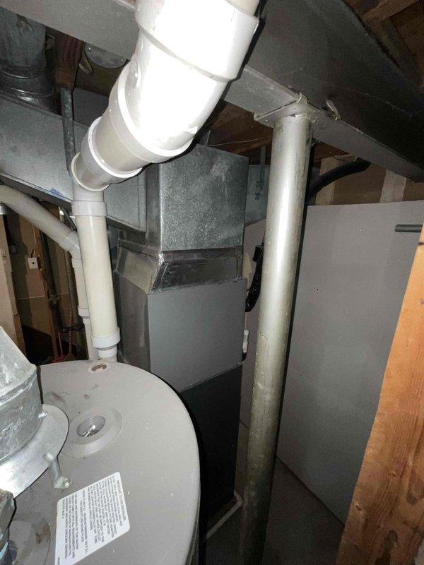 Conducted on-site assessment for 3.5 ton air conditioning system replacement in 2400 square foot single family residence. Inspected existing HVAC equipment located in basement mechanical room, documented current furnace and ductwork configuration, photographed equipment specifications and system layout to provide accurate replacement estimate for homeowner comparing multiple contractor quotes.