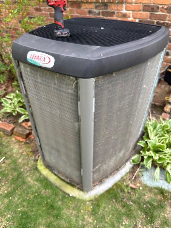 # HVAC Maintenance - ACM

Completed annual preventive maintenance on Lennox outdoor condensing unit. Performed comprehensive system inspection including electrical testing with multimeter, verified proper operation of all components, and assessed overall unit condition. Unit showed typical environmental wear with accumulated dirt and debris on coil fins and exterior panels. Concrete pad exhibited normal weathering with minor vegetation growth. All electrical connections tested and confirmed secure. System operational parameters verified within manufacturer specifications.