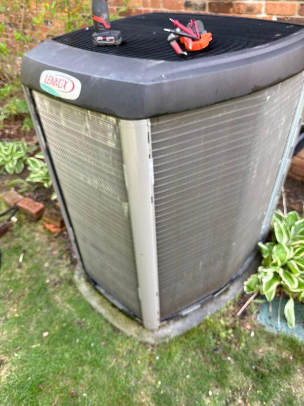 # HVAC Maintenance - ACM

Completed annual preventive maintenance on Lennox outdoor condensing unit. Performed comprehensive system inspection including electrical testing with multimeter, verified proper operation of all components, and assessed overall unit condition. Unit showed typical environmental wear with accumulated dirt and debris on coil fins and exterior panels. Concrete pad exhibited normal weathering with minor vegetation growth. All electrical connections tested and confirmed secure. System operational parameters verified within manufacturer specifications.