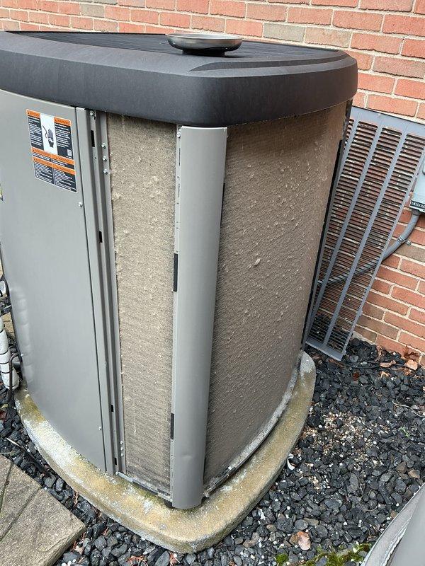 Completed annual HVAC maintenance on two outdoor air conditioning units. Replaced heavily soiled air filters on both units, which showed significant accumulation of dirt, dust, and debris affecting airflow efficiency. Cleaned condenser pads and removed organic debris from surrounding areas to ensure proper drainage and unit operation.