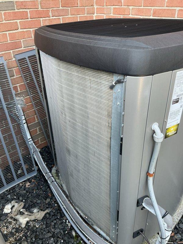 Completed annual HVAC maintenance on two outdoor air conditioning units. Replaced heavily soiled air filters on both units, which showed significant accumulation of dirt, dust, and debris affecting airflow efficiency. Cleaned condenser pads and removed organic debris from surrounding areas to ensure proper drainage and unit operation.