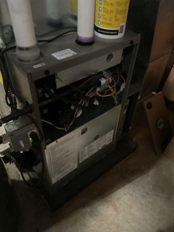 Completed annual HVAC maintenance on residential heating and cooling system. Performed comprehensive inspection of gas furnace, verified proper burner operation with blue flame combustion, tested gas valve functionality, and examined all electrical connections and wiring. Inspected draft inducer motor assembly, PVC intake and exhaust venting, and internal components for wear or damage. Replaced air filters as needed and ensured all safety controls were operating within manufacturer specifications. System tested and left in proper working condition.