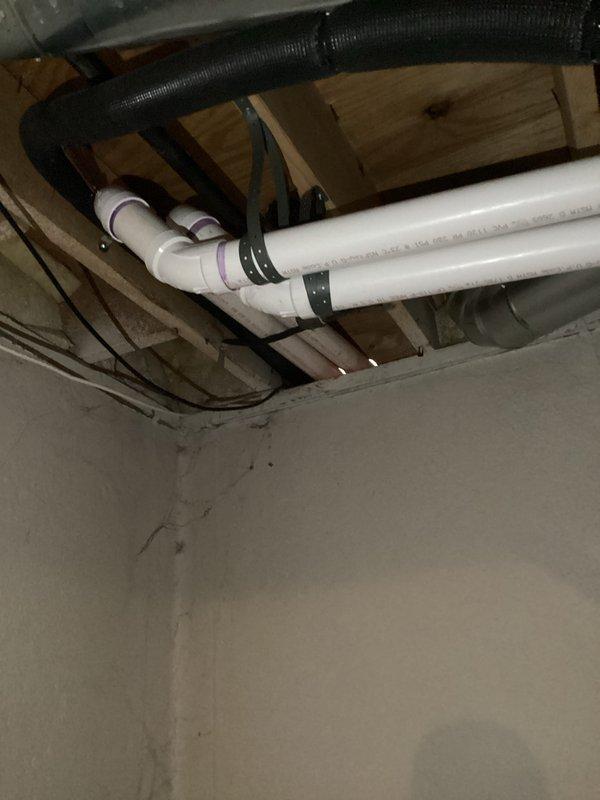 Completed full HVAC system installation including a 90,000 BTU gas furnace and 3-ton air conditioning unit with rear discharge configuration. Installed new PVC venting system properly secured to ceiling joists with appropriate hangers and clamps, routed electrical connections using flexible conduit, and reconnected all utilities. All mechanical and electrical permits obtained, equipment properly positioned in basement utility area, and system tested for proper operation upon completion.