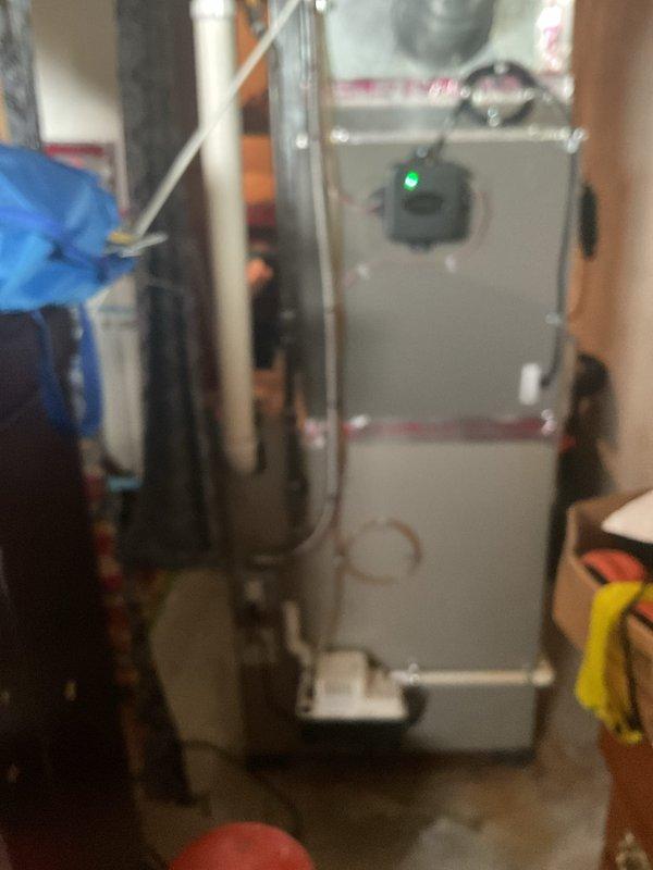 Completed installation of 2.5 ton air conditioning system with evaporator coil in residential property. Installed new outdoor condensing unit with rear discharge configuration on grade-level pad, connected refrigerant lines with proper insulation, and mounted indoor evaporator coil in existing plenum measuring 19.5 inches deep. System was pressure tested, evacuated, charged to manufacturer specifications, and tested for proper operation with all electrical connections verified and secured.