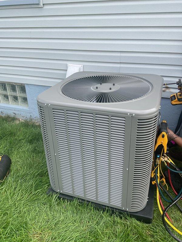 Completed installation of 2.5 ton air conditioning system with evaporator coil in residential property. Installed new outdoor condensing unit with rear discharge configuration on grade-level pad, connected refrigerant lines with proper insulation, and mounted indoor evaporator coil in existing plenum measuring 19.5 inches deep. System was pressure tested, evacuated, charged to manufacturer specifications, and tested for proper operation with all electrical connections verified and secured.