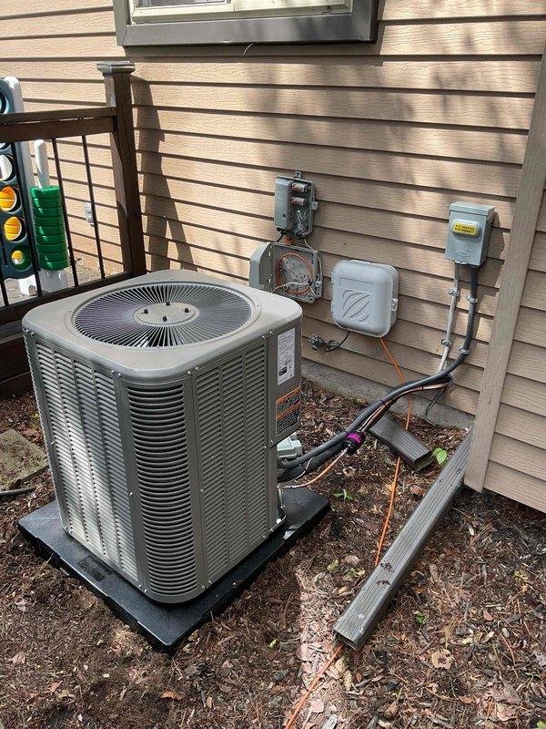 Completed full HVAC system installation including a 70,000 BTU gas furnace and 2-ton air conditioning unit with rear discharge configuration. Installed new outdoor condenser unit on protective pad with proper electrical disconnect and refrigerant line connections. Mounted indoor air handler in utility closet with integrated ductwork. Added humidifier system to furnace for whole-home humidity control. Reconnected all electrical, gas, and refrigerant lines to manufacturer specifications. Verified proper system operation, airflow, and temperature differential across both heating and cooling modes. All components tested and confirmed operational with paperwork completed for utility rebate programs.