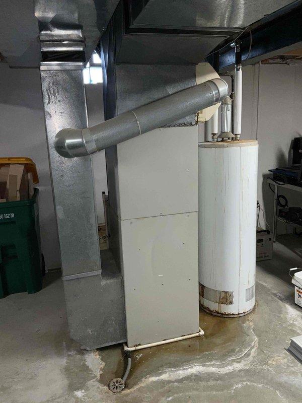 Completed on-site assessment of existing air conditioning system utilizing obsolete R-22 refrigerant. Evaluated outdoor condenser unit and indoor HVAC components in basement utility area. Documented equipment condition through photographic documentation, noting age-related wear and system configuration. Provided comprehensive replacement estimate for new cooling system as requested, discussing options with homeowner who indicated preference for replacement over repair based on refrigerant phase-out and equipment longevity concerns.
