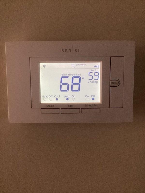 Completed annual cooling maintenance on HVAC system. Inspected thermostat operation and confirmed proper temperature readings and WiFi connectivity. Noted significant rust and corrosion on interior metal components and mounting brackets, along with dust accumulation throughout the unit. Filter replacement required and recommended due to visible debris and system conditions.
